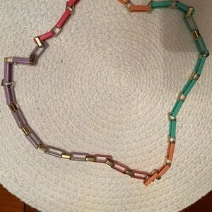 Metal neckless with gold plated and colored links. 32” long.